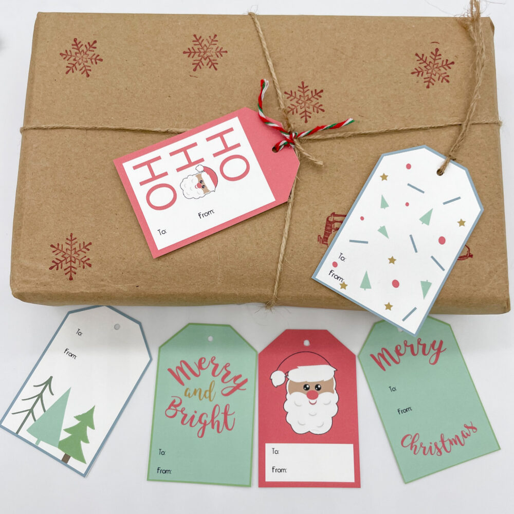 christmas tags on kraft paper package on white background