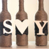 Rustic Wine Bottle Centerpiece | 3 Wrapped Wine Bottles with Two letters and Heart | Custom Colors of Lace and Letters Included